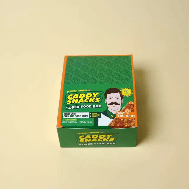Caddy Snacks super food bar packaging on a beige background