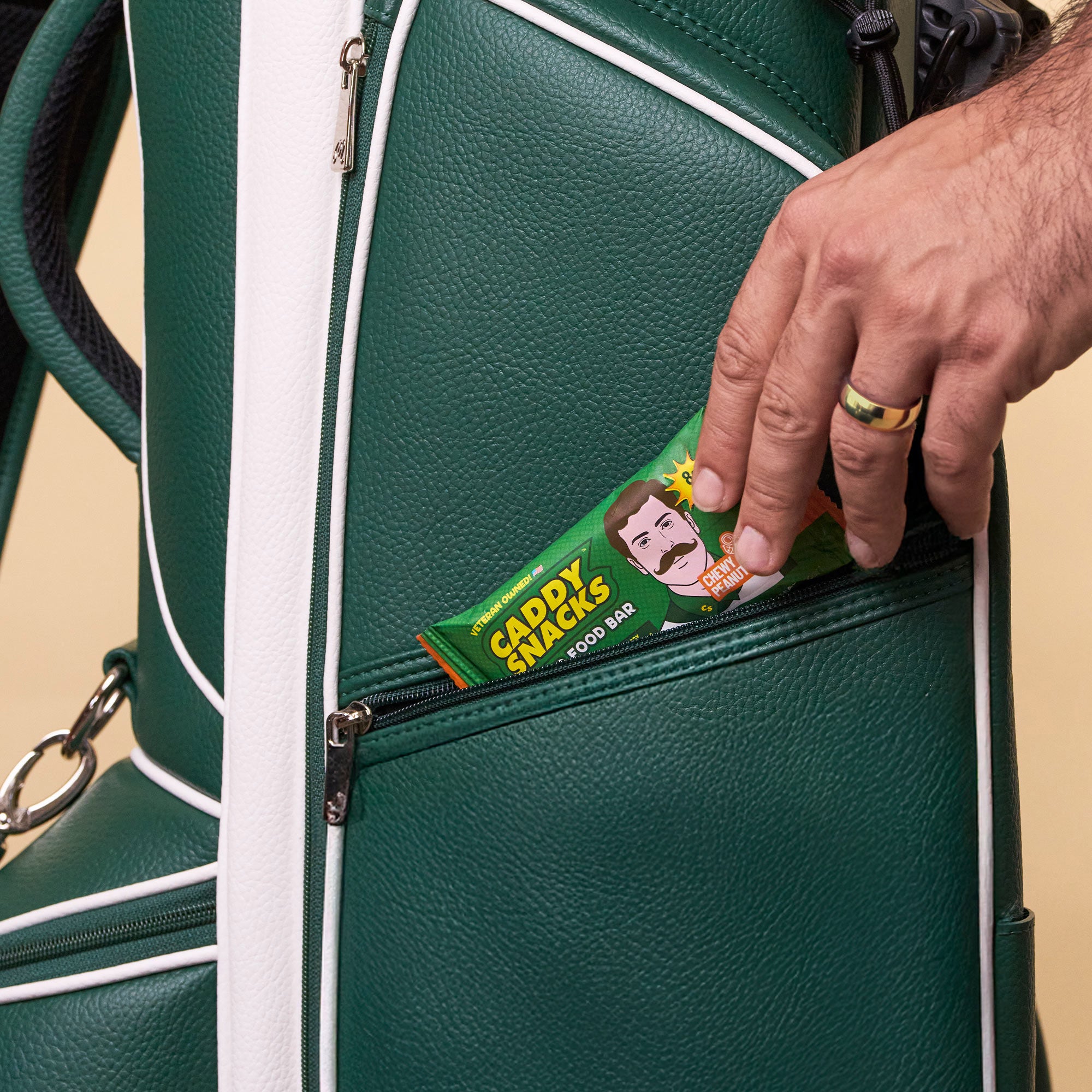 Chewy peanut butter snack bar in pocket of green bag