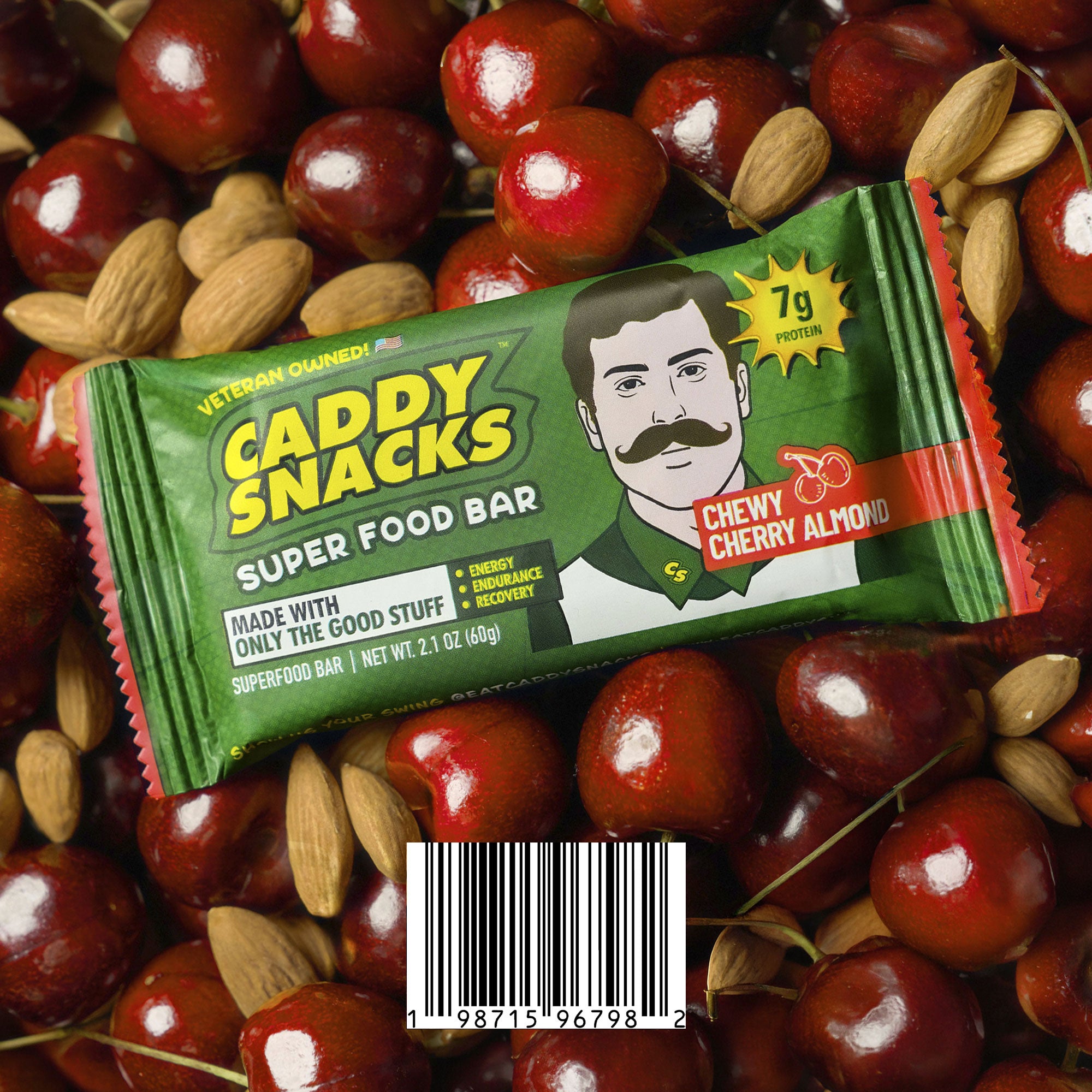 Caddy Snacks superfood bar packaging on a background of cherries and almonds