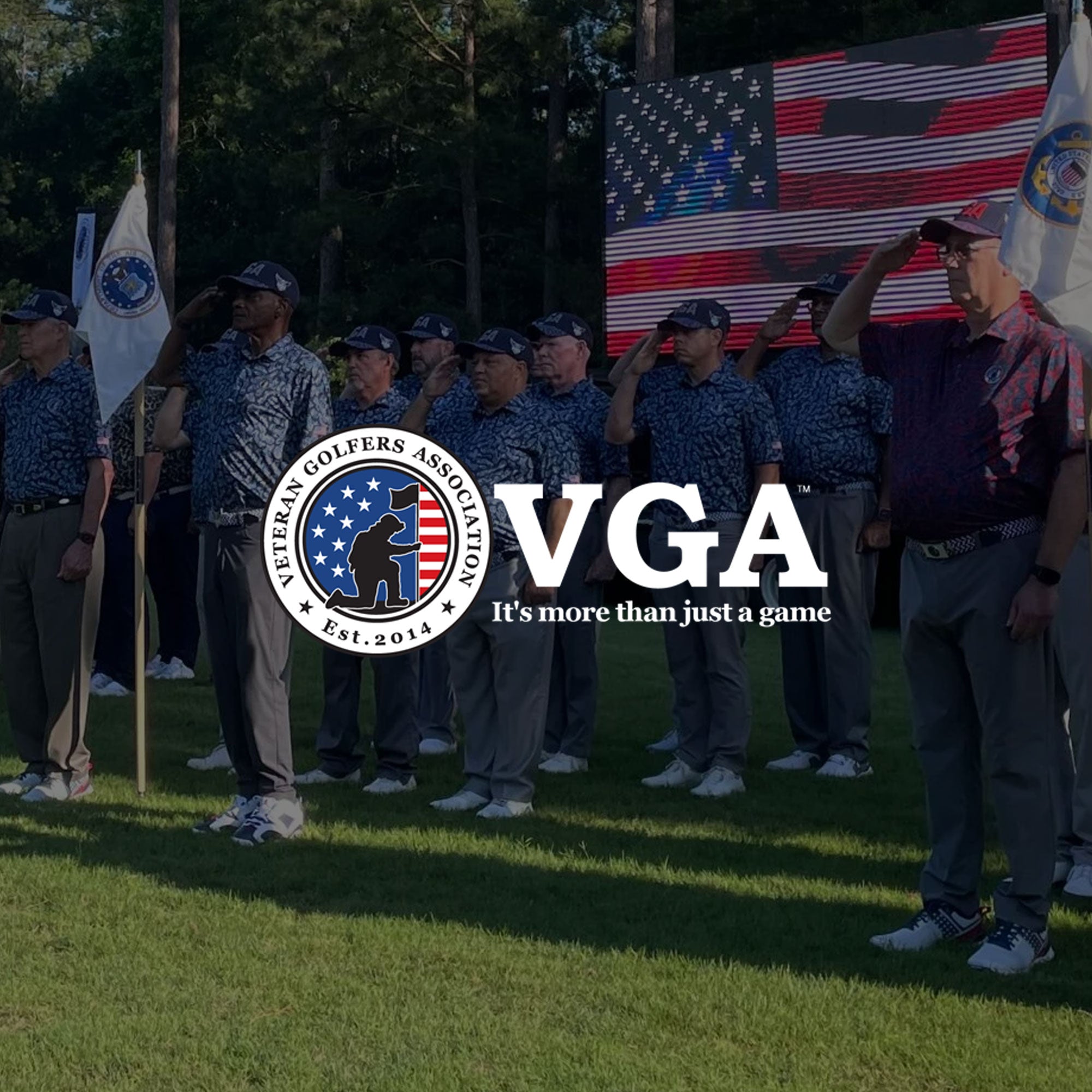 Group of men in uniform standing on a grassy field with an American flag, Veterans Golfers Association logo overlayed.